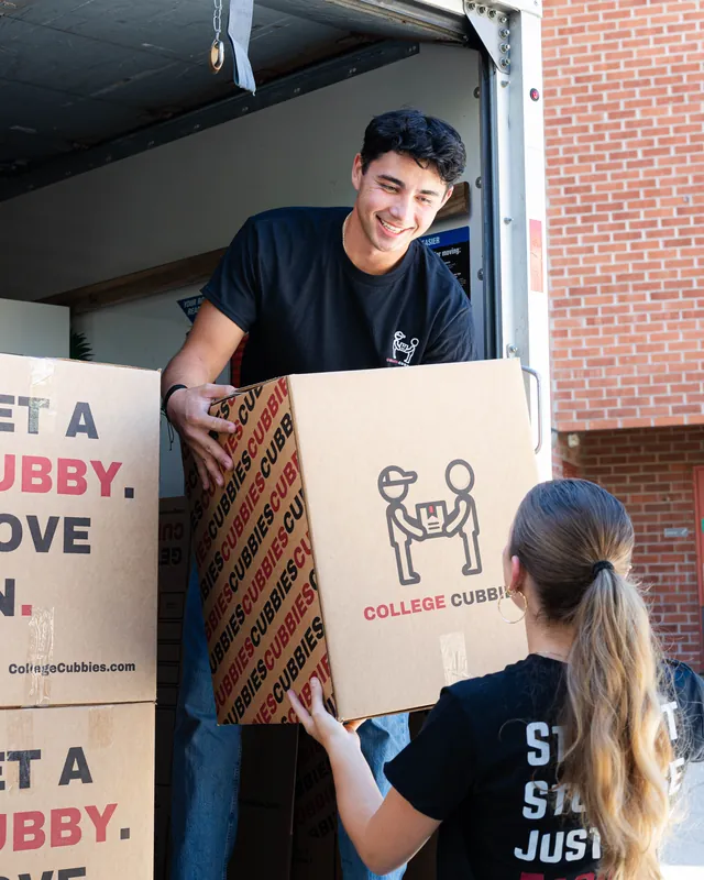College students and the College Cubbies crew smiling on move day
