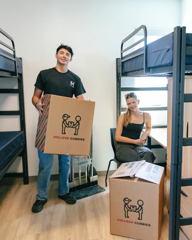 College students and the College Cubbies crew smiling on move day
